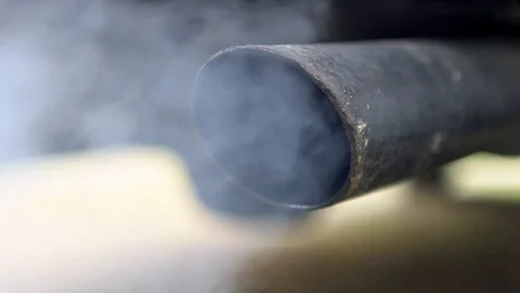 Slow Motion combustion fumes coming out of car exhaust pipe, strongly smoke-Dan Stock Footage