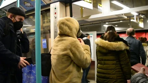 Slow motion, commuters leaving train car, man wearing face mask Stock Footage 126299451