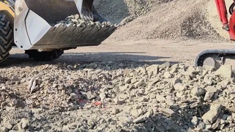 Slow Motion Compact Excavator Breaking Hard Ground and Discharging Soil - 4K Vídeos de archivo 331602496