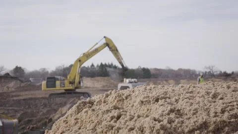 Slow Motion Construction Backhoe Moving Through Excavation Site Stock Footage 144904939