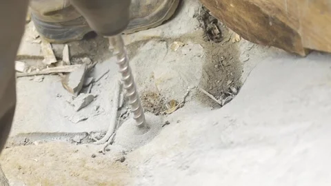 Slow motion of construction worker drilling rock 스톡 동영상 255684361