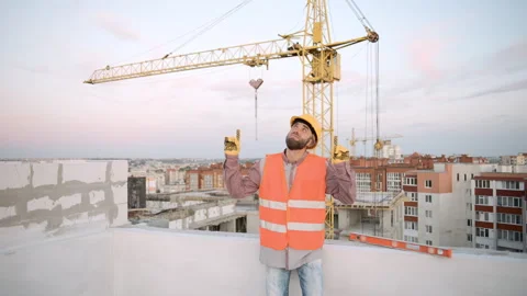 Slow motion of construction workers on building site Stock Footage 303231438