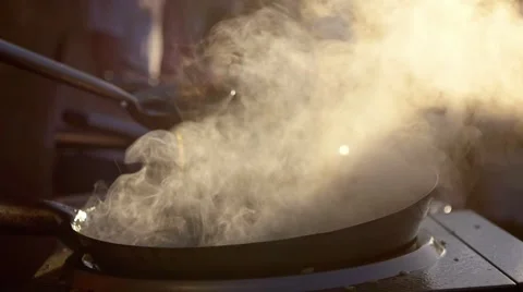 Slow motion: cook makes asian noodles in wok. a versatile round-bottomed cooking Stock Footage