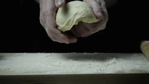Slow motion cook squeezes dough Stock Footage 72782071