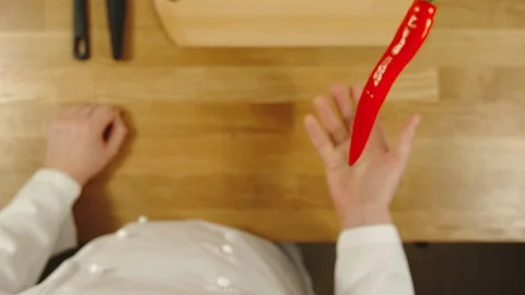 SLOW MOTION: Cook throws up chilli and catches it - Top View Видео 99083003