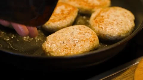 Slow motion of cooking cutlets in a pan, close-up Stock Footage 311973183
