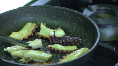 Slow motion of cooking octopus in a pan Stock Footage 71601705