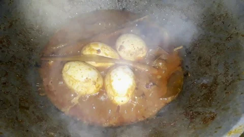 Slow motion cooking rendang with eggs. Rendang is one of the best food Stock-Footage 114093576