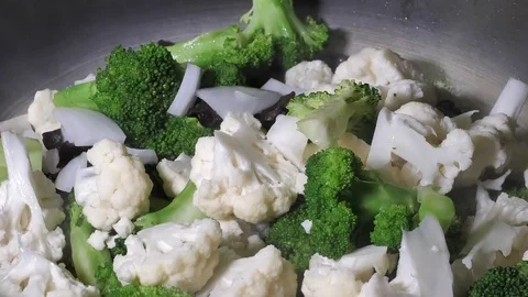 Slow motion of cooking vegetables with steam in a pan Stock Footage 80436543
