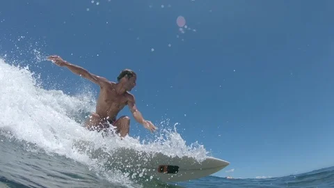 SLOW MOTION Cool surfer stands up on his surfboard as he catches a breaking wave Video stock 90080100