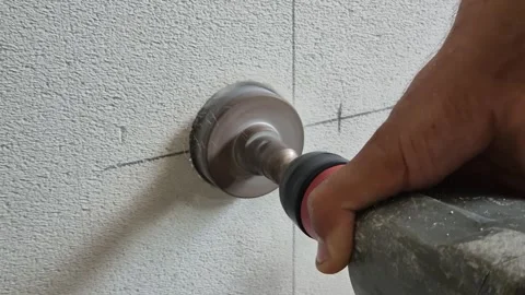 Slow Motion: Core Drilling Marked Aerated Concrete Wall Close-up 動画素材 342621386
