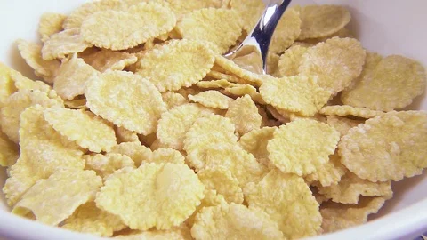 Slow motion in corn flakes pour milk close-up Stock Footage 92376268