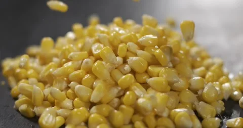 Slow motion of corn kernels falling and bouncing on a surface Видео 337228894