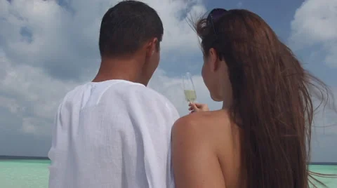 Slow Motion Of Couple In Love Toasting And Drinking Champagne On The Beach Stock Footage 45590414