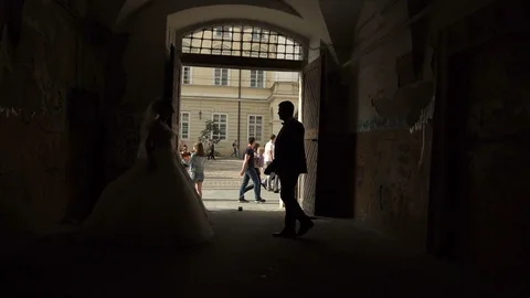 Slow motion. Couple walking holding hands in old european city of Ukraine Stock Footage 96016374
