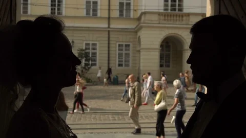 Slow motion. Couple walking holding hands in old european city of Ukraine Stock Footage 96017254