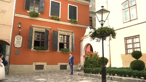 Slow motion. Couple walking holding hands in old european city of Ukraine Stock Footage 96018250
