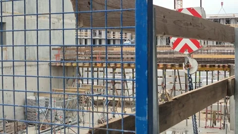 Slow Motion Crane Hook and Chains Past Platform Stock Footage 335591429