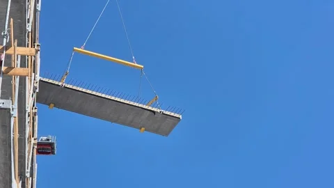 Slow Motion Crane Lifting Concrete Floor Slab Stock Footage 338400683
