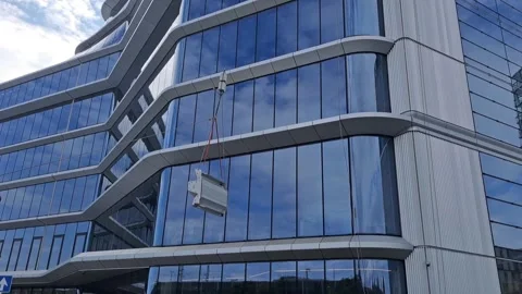 Slow Motion of Crane Lifting Facade Panel with Tag Line Vídeos de archivo 332902661