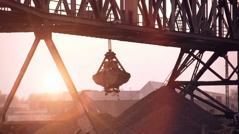Slow motion of crane moving sand at construction site Video stock 72867352