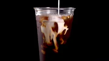 Slow Motion Cream in Coffee Stock Footage