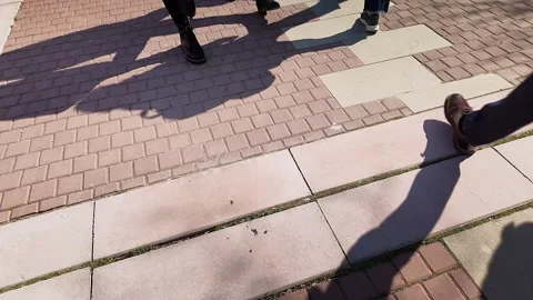 Slow Motion Crowd Feet Casting Long Shadows Stock Footage 331591051
