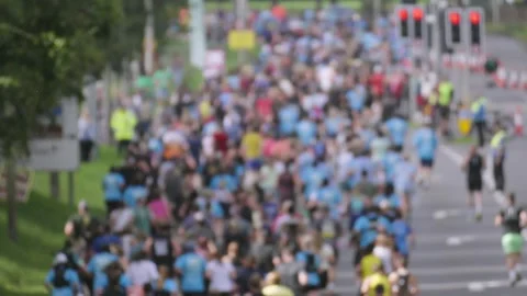 Slow Motion Crowd of Joggers Facing Away from Camera. Stock Footage 346816723