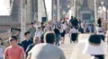 Slow motion crowd of people on Brooklyn Bridge New York City sunny summer day HD Footage