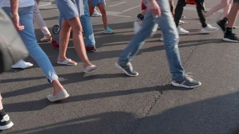 Slow motion of a crowd of people crossing the street Stock Footage 102845408