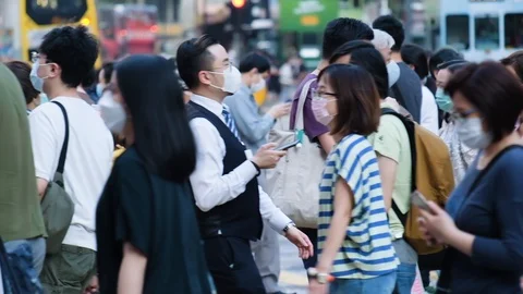 Slow motion of crowd people wearing medical face masks at metro in Hong Kong. Stock Footage 129602919