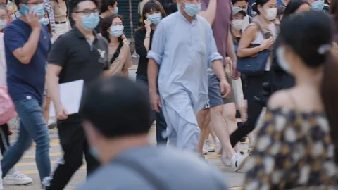 Slow motion of crowd people wearing medical face masks at metro in Hong Kong. Stock Footage
