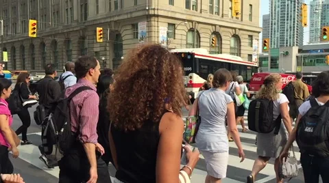 Slow motion, crowd of Toronto commuters walk across road Stock Footage 57113875