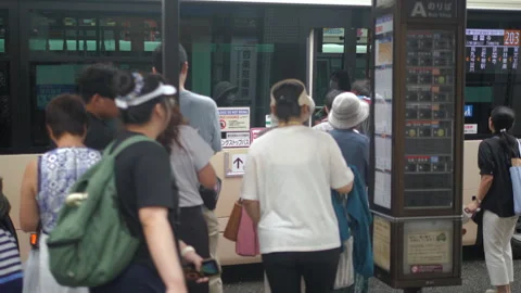 Slow Motion Crowd Waiting at Bus Stop in Kyoto, Japan Stock Footage 338155820
