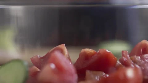 Slow motion of cucumber slices dropping on Greek Salad Video stock 262459611