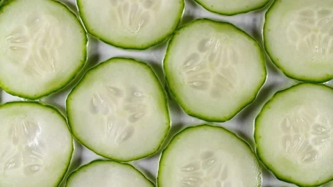 Slow Motion Cucumbers Slices Rotating. Cucumber Pattern. Healthy Food Background Stock-Footage 155766919