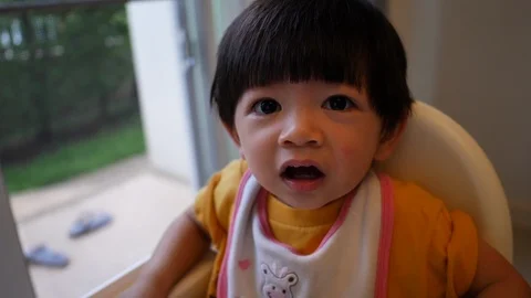 Slow motion cute child face stunning shock Stock Footage 92421345
