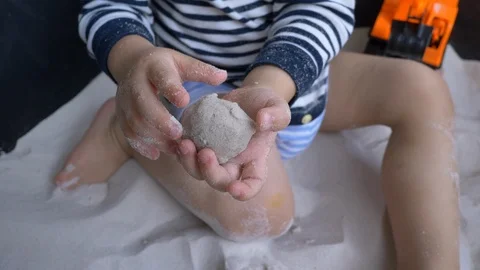 Slow motion, cute child playing sand in playground of pre-kindergarten Stock Footage 95010720