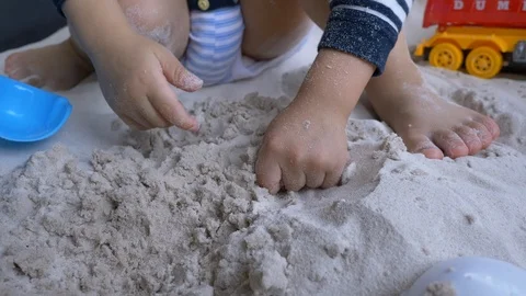 Slow motion, cute child playing sand in playground Stock Footage 99321038