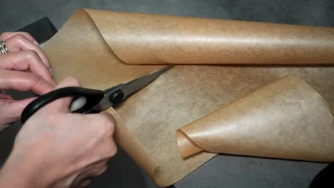 Slow Motion Cutting Baking Paper with Scissors Video stock 320393530