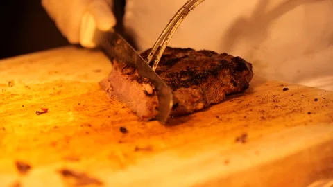 Slow motion cutting beef on cutting board 스톡 동영상 112767846