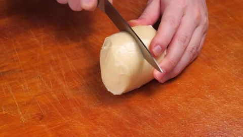 Slow motion of cutting cheese close up Stock Footage 146880243