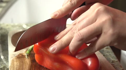 Slow Motion Cutting a Red Pepper for Cooking Stock Footage 62356558