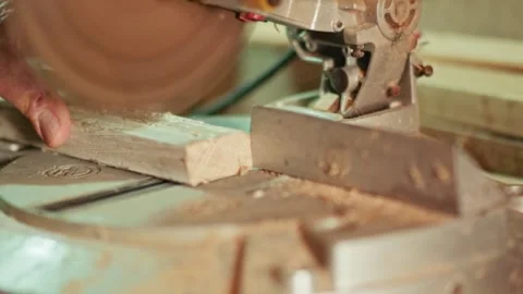 Slow motion cutting wood with miter saw in workshop Stock Footage 346345281