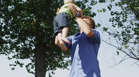 Slow motion dad having fun with infant son Видео 67297779
