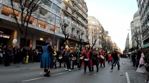 A SLOW MOTION OF A DANCE CARNIVAL PARADE IN A TOWN IN GREECE Stock-Footage 333655547