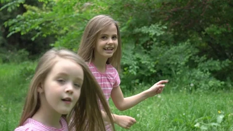 Slow Motion Dancing and be happy. Little girls together in nature. Stock Footage