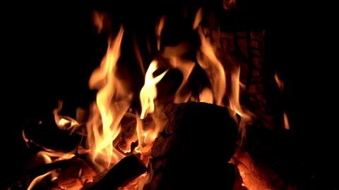 SLOW MOTION Dancing Flames in Fire Pit on Black Background Stock Footage 104564169
