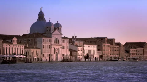 Slow motion, daytime shot of a the Bauer Palladio hotel over the waterway. Stock Footage 52302037