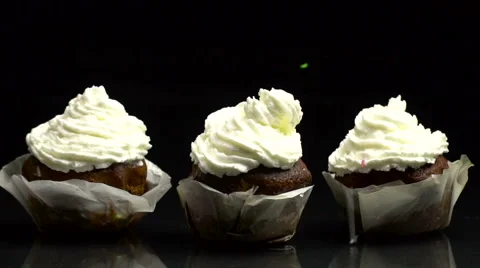 Slow Motion Decorating Cup-Cakes with Sprakles Video stock 67648373
